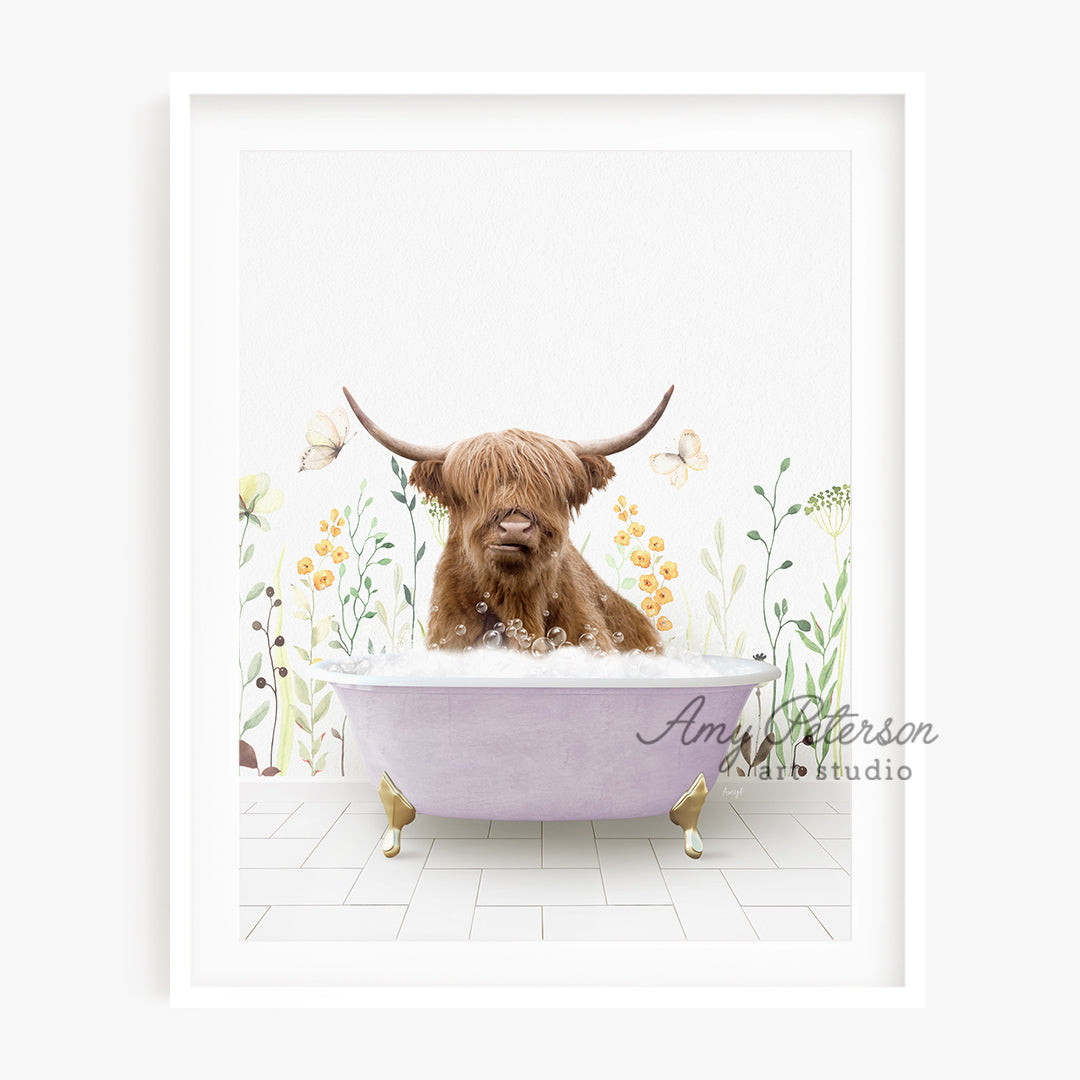 a brown dog sitting in a bathtub with long horns