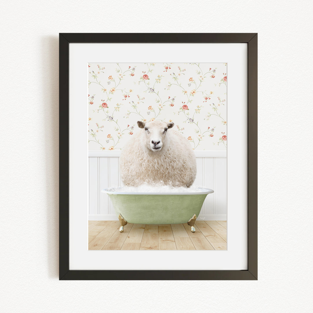 A fluffy white sheep sits in a green bathtub, surrounded by a floral wallpaper.