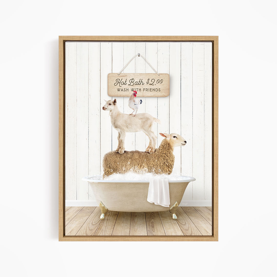 A framed image depicting a goat standing on top of a sheep in a bathtub, with a sign above that reads "Hot Bath $2.00 WASH WITH FRIENDS".