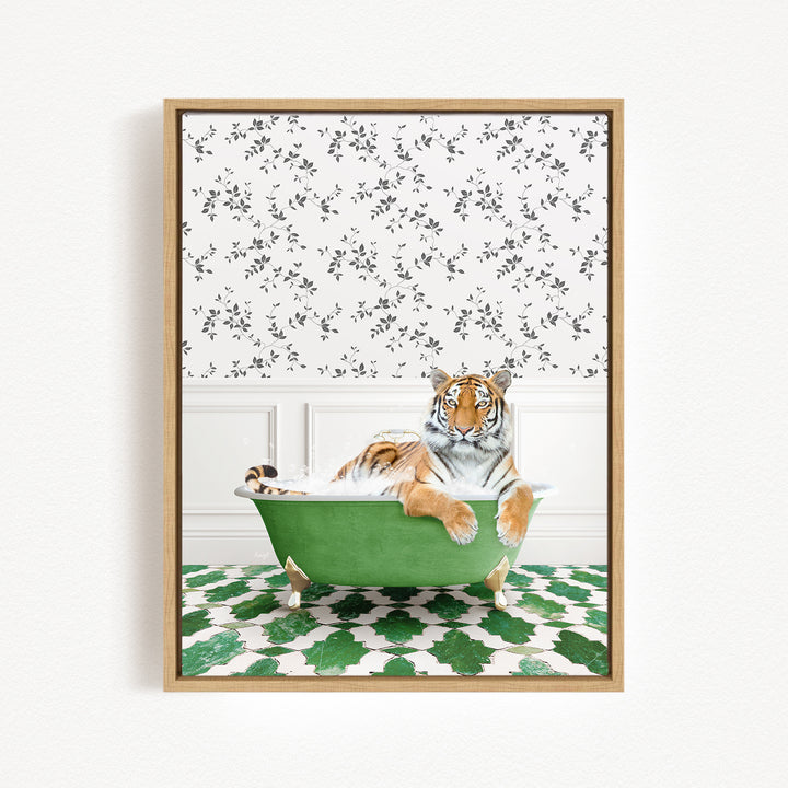 A tiger is sitting in a green bathtub, surrounded by a patterned wall and a green and white tiled floor.