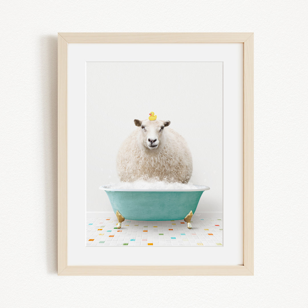 A fluffy white sheep sits in a blue bathtub, with a yellow duck perched on its head.