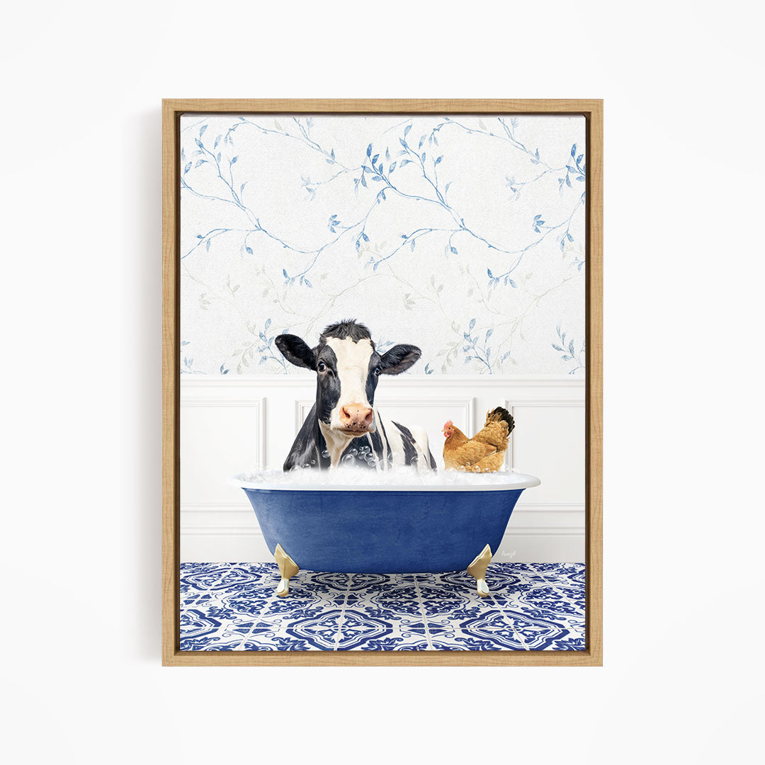 A black and white cow is sitting in a blue bathtub, with a chicken standing nearby, in a bathroom setting with a blue and white patterned tile floor.