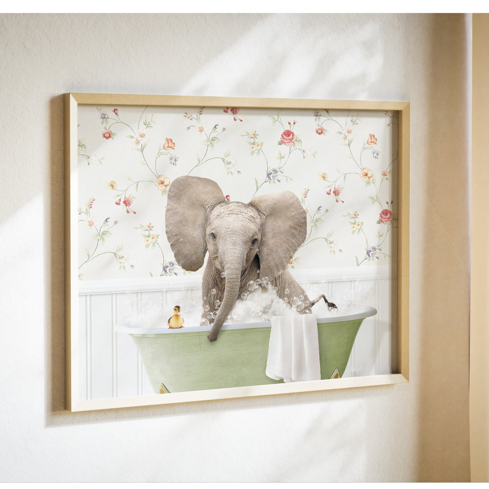 A framed image of an elephant sitting in a bathtub, surrounded by flowers and bubbles.
