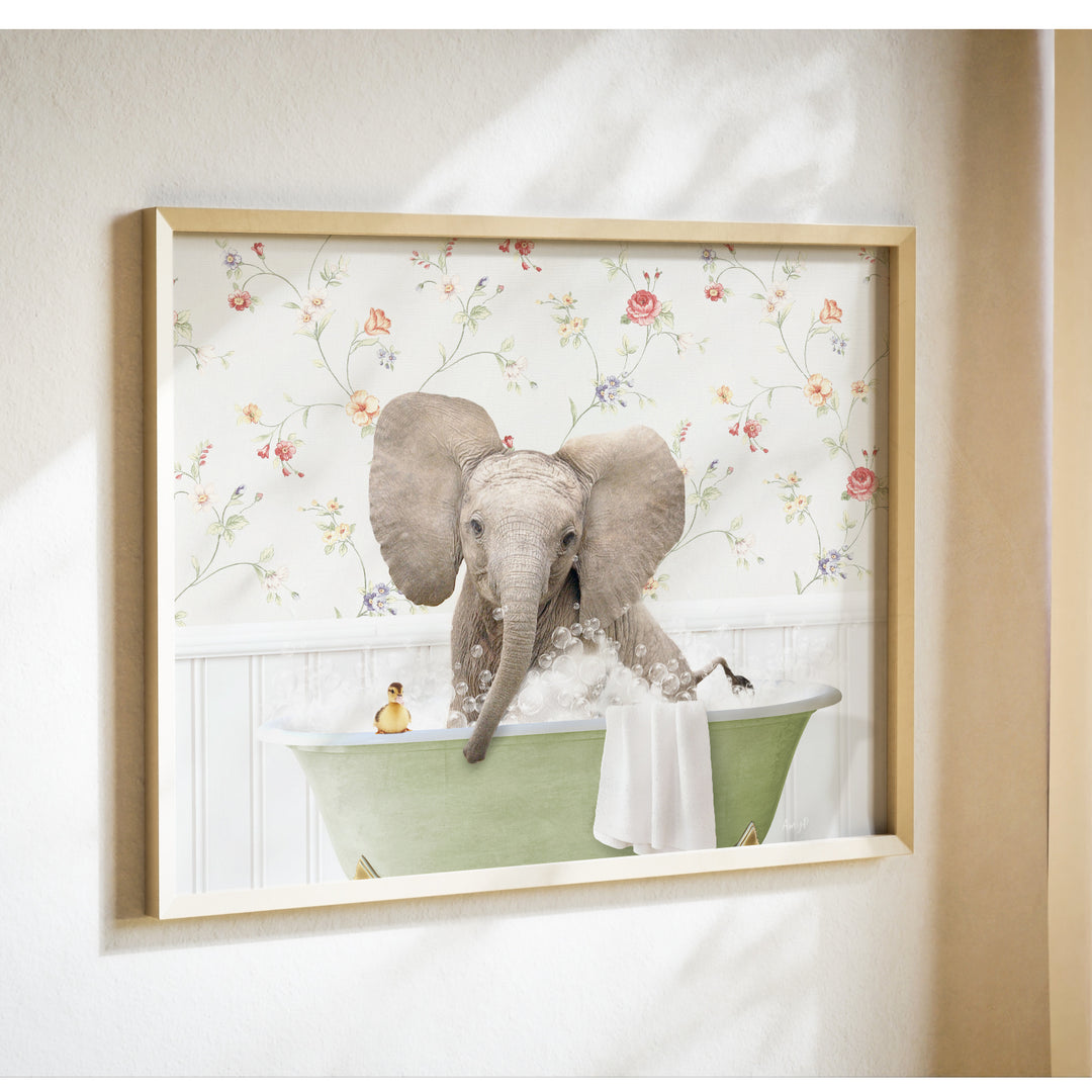 A framed image of an elephant sitting in a bathtub, surrounded by flowers and bubbles.