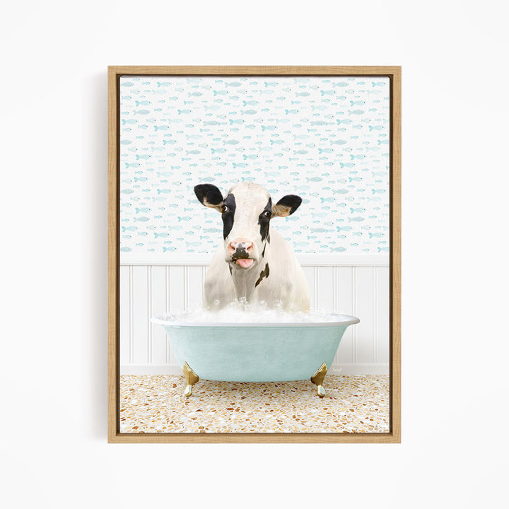 A cow is sitting in a bathtub filled with water, surrounded by a pattern of fish.