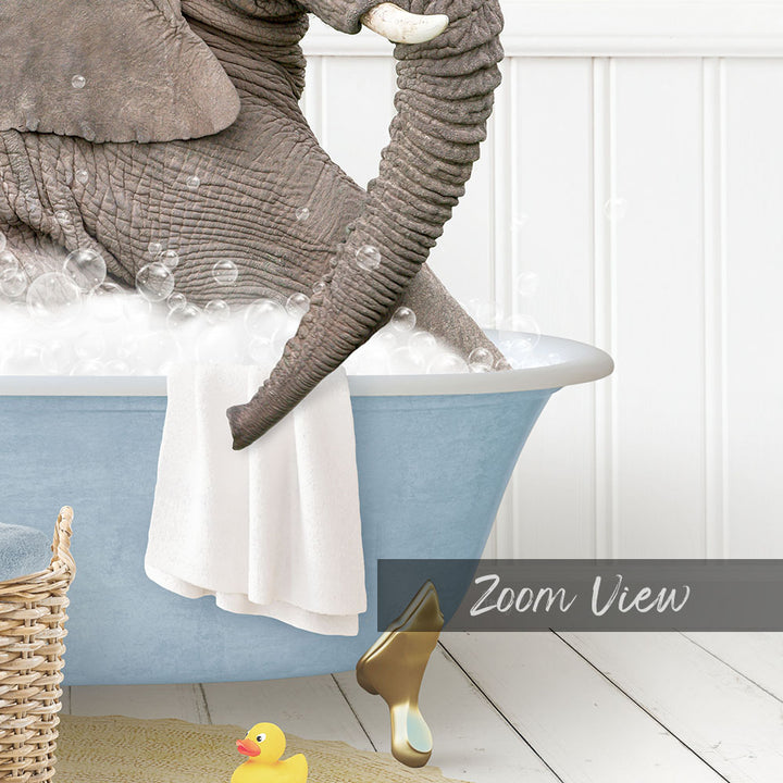 A large gray elephant is sitting in a blue bathtub filled with bubbles, surrounded by a yellow rubber duck and a basket.