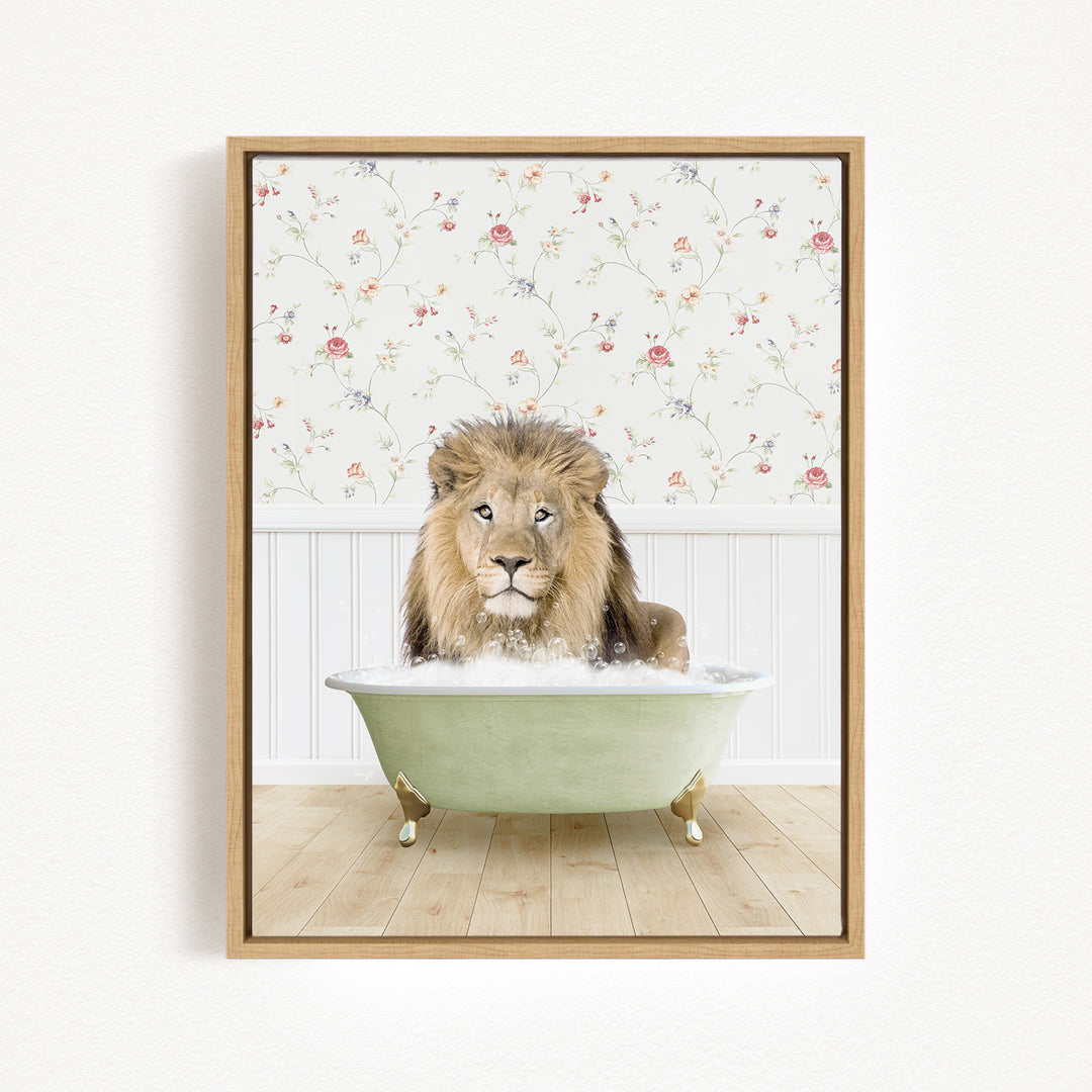 A lion sitting in a green bathtub filled with bubbles, with a floral wallpaper in the background.