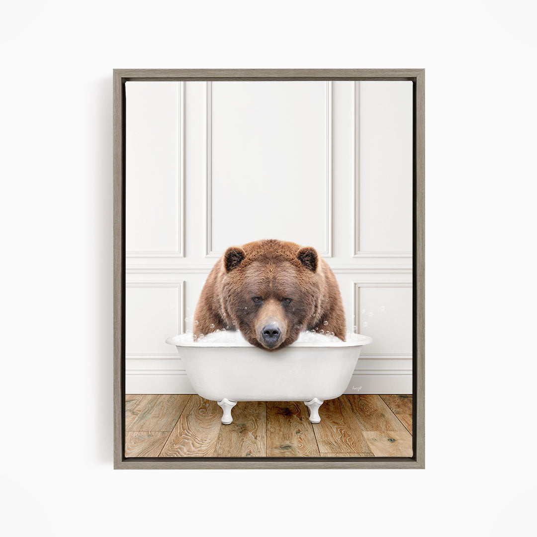 A brown bear sitting in a white bathtub, appearing to be enjoying a relaxing bath.