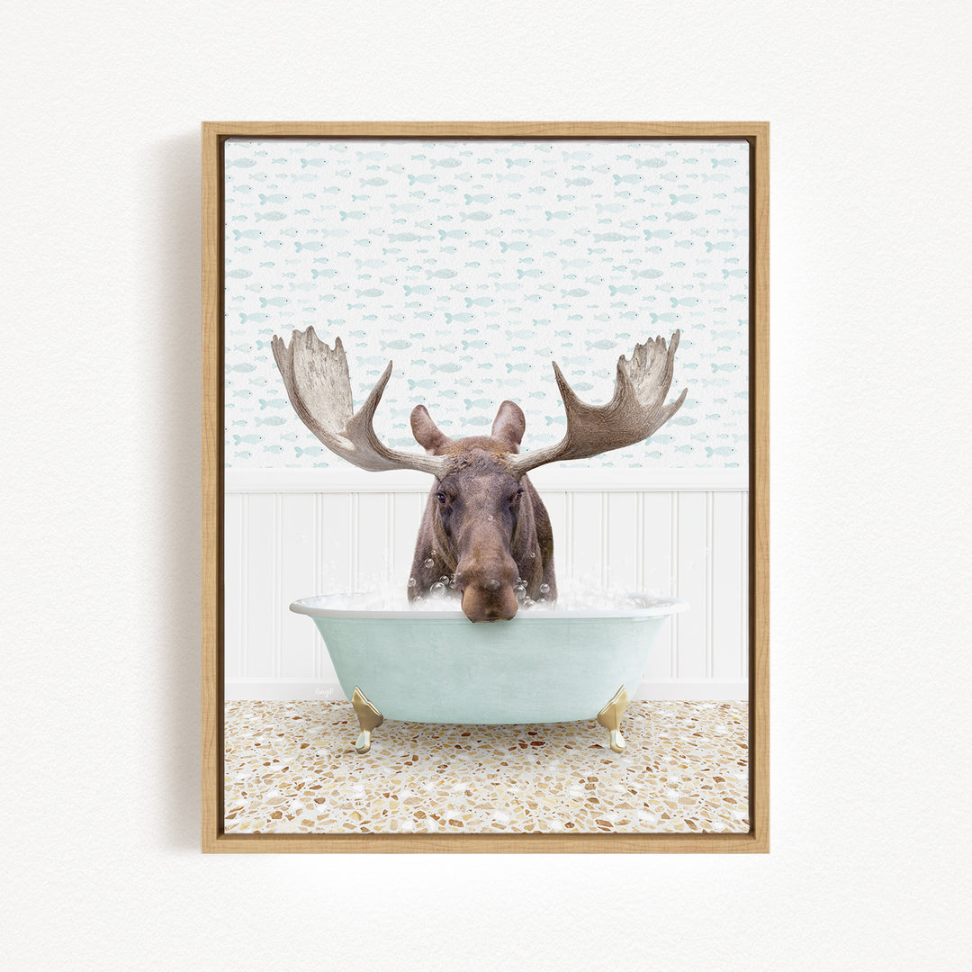A moose with large antlers is sitting in a bathtub filled with water, creating a whimsical and humorous scene.
