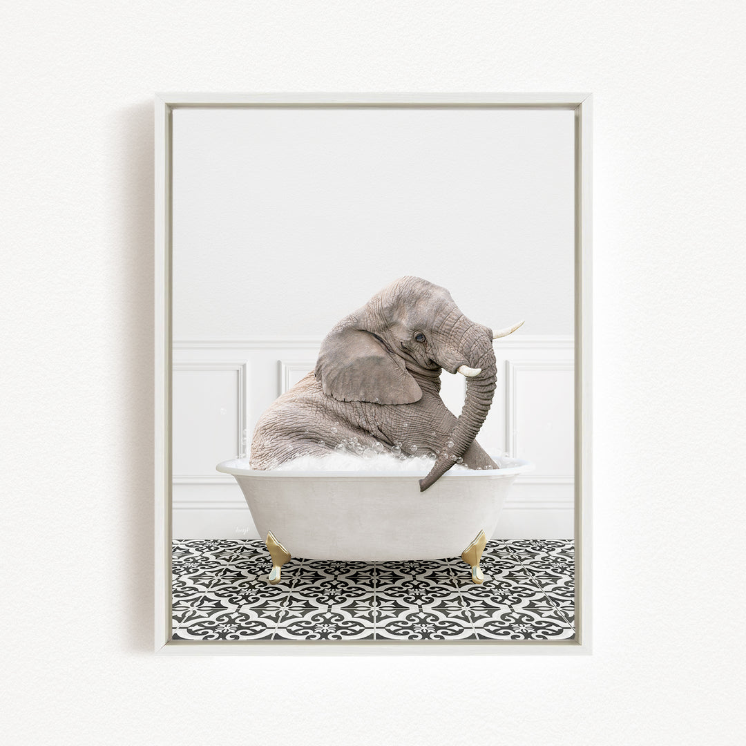 A gray elephant is sitting in a white bathtub filled with water, surrounded by a black and white patterned floor.