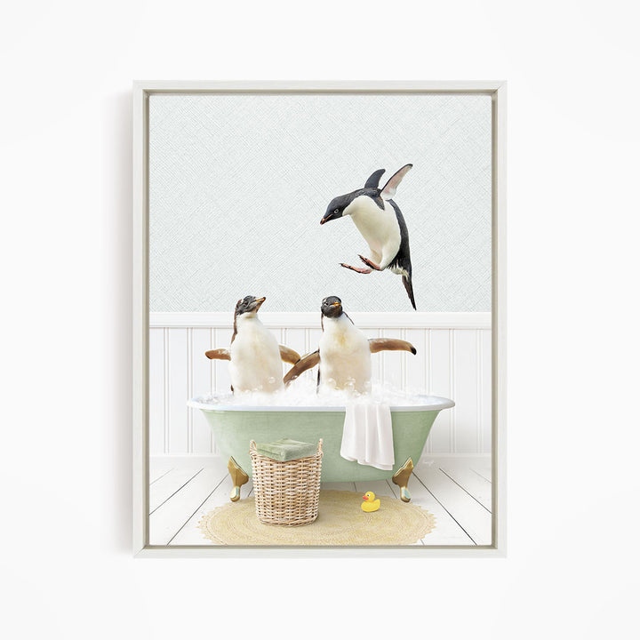 A framed image depicting two penguins sitting in a bathtub, with one penguin flying towards the other penguin.