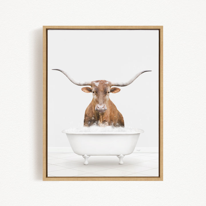 A brown cow with long horns is sitting in a white bathtub filled with water, creating a whimsical and humorous scene.
