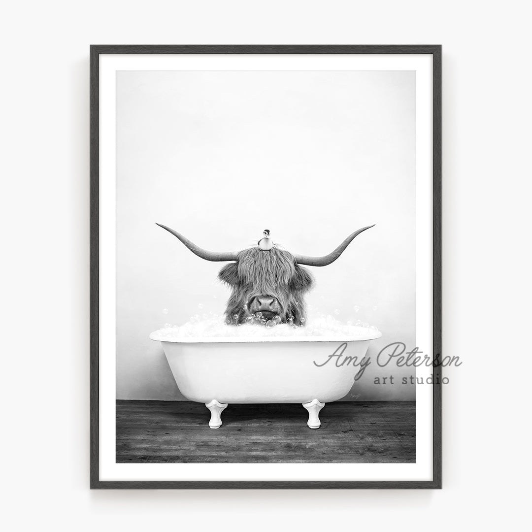 a black and white photo of a bull in a bathtub