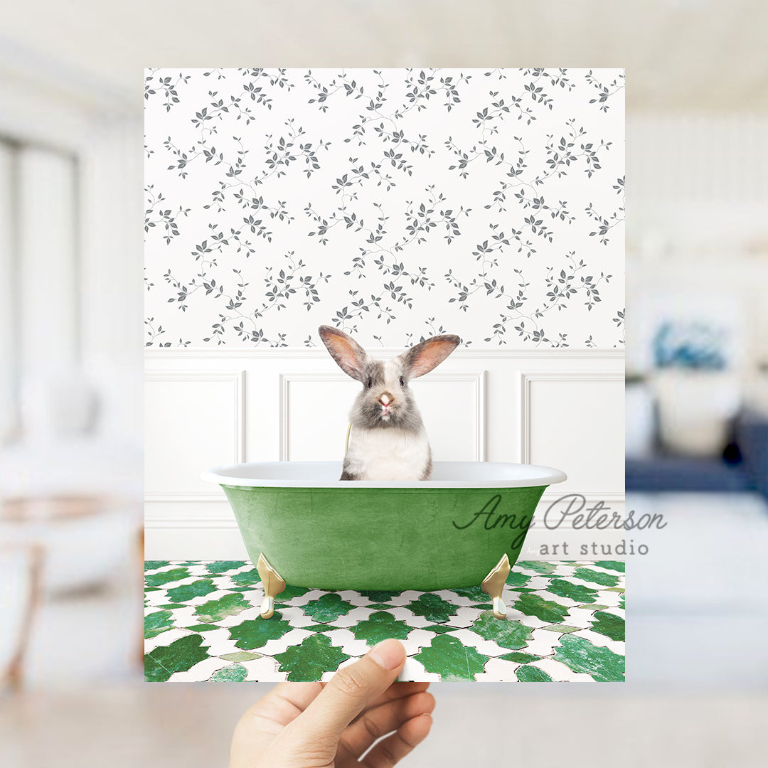 a person holding up a card with a picture of a rabbit in a bathtub