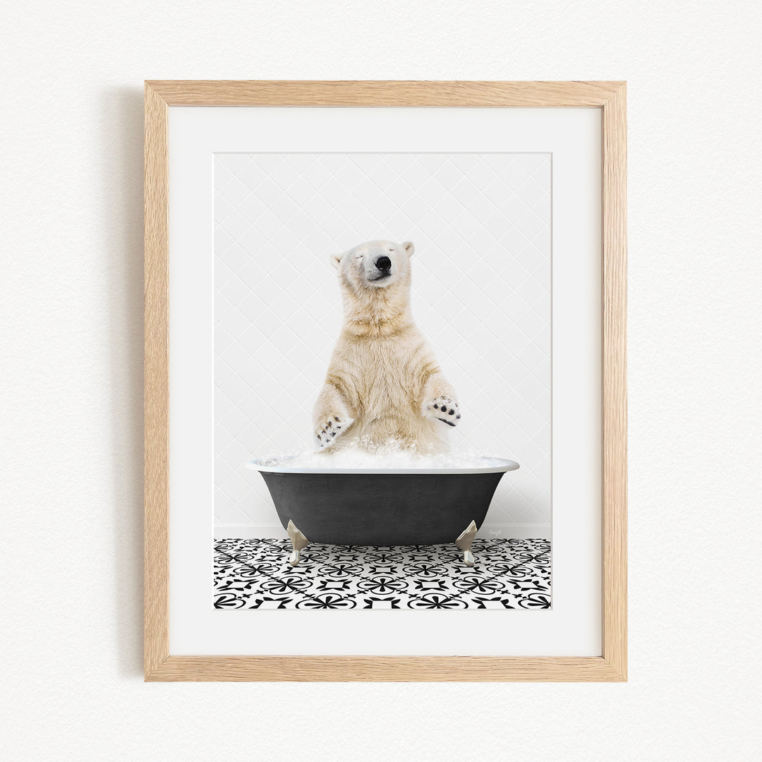 A polar bear standing in a black bathtub filled with water, with its paws submerged in the water.