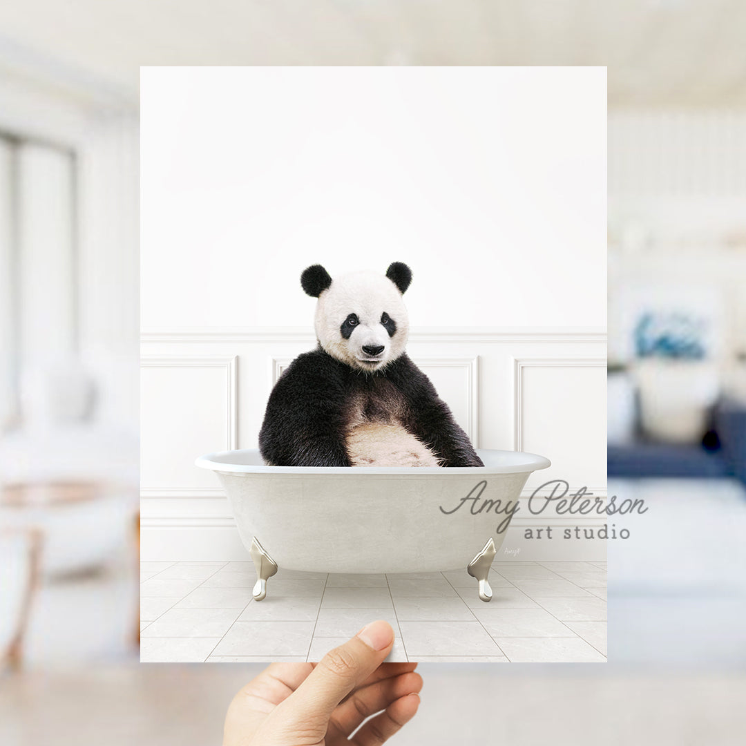 a panda bear sitting in a bath tub