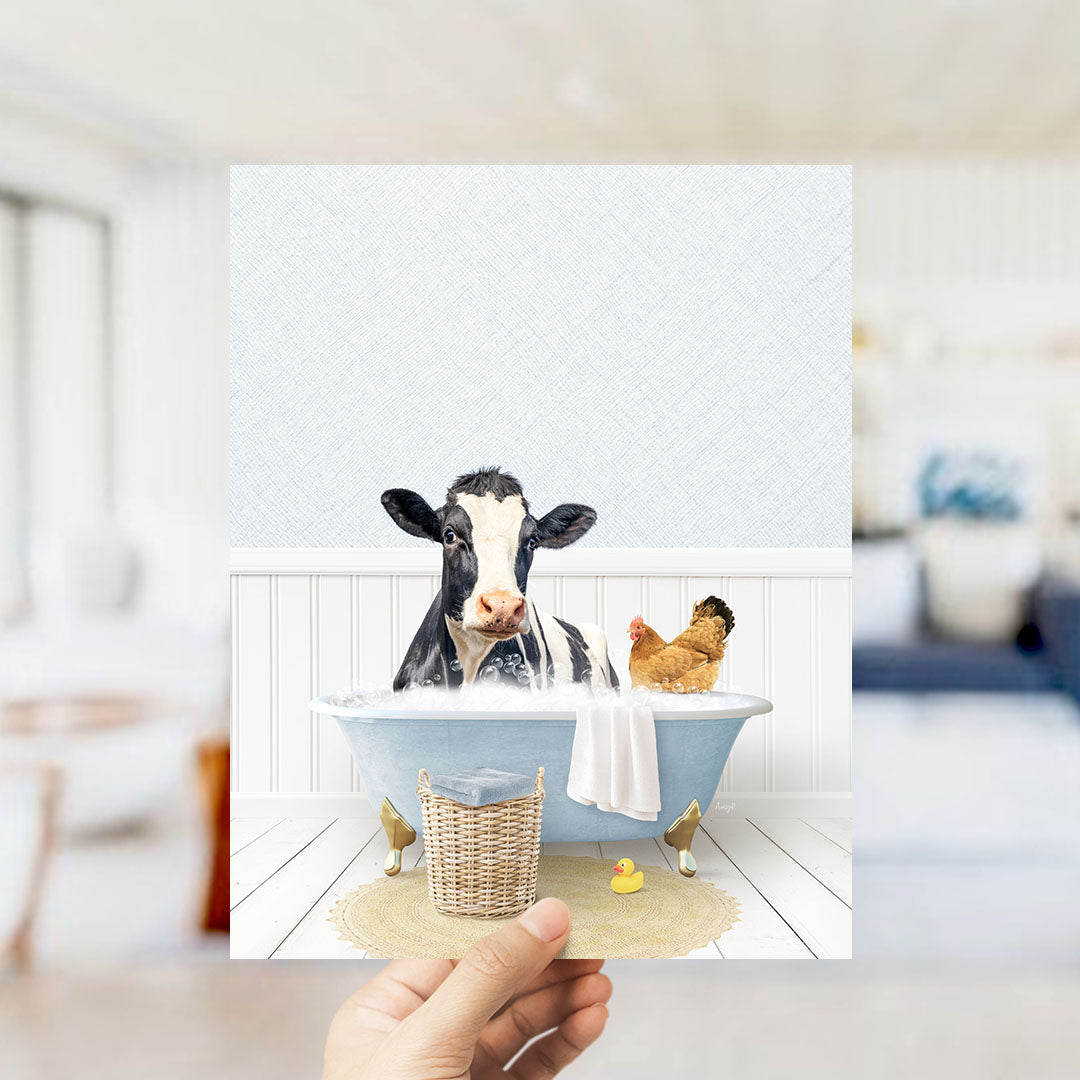 A cow and a chicken are sitting in a bathtub filled with water, surrounded by a basket and a rubber duck.