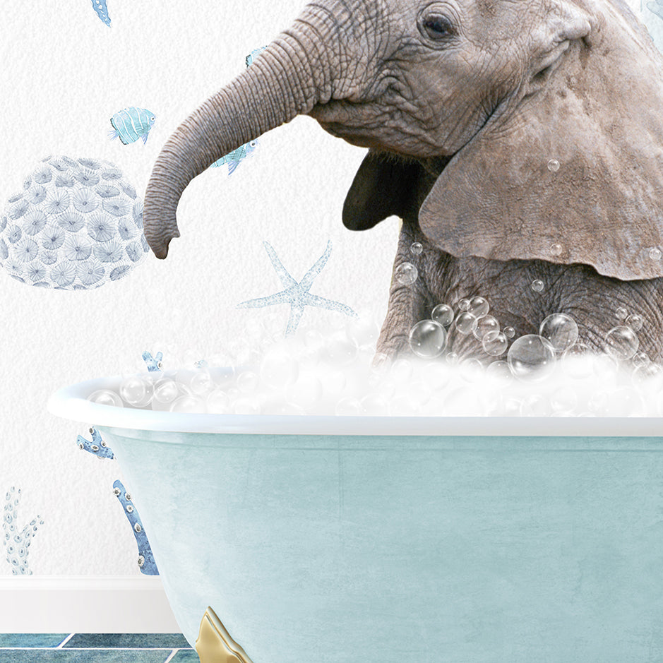 a baby elephant in a bathtub with bubbles