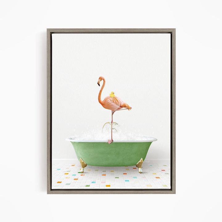 A pink flamingo stands on a green bathtub filled with bubbles, with a yellow duck sitting on its back.