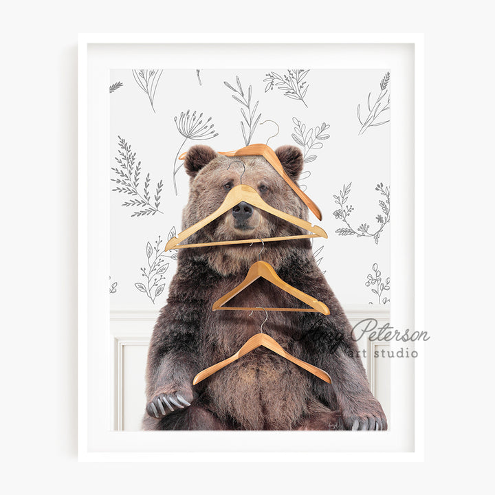 a picture of a bear with clothes hangers on his head