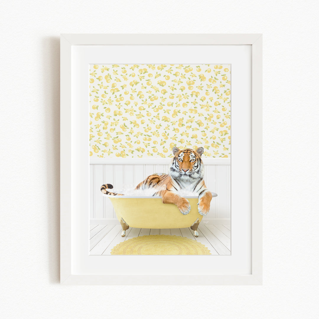 A tiger is sitting in a yellow bathtub, surrounded by a yellow and white floral patterned wall.