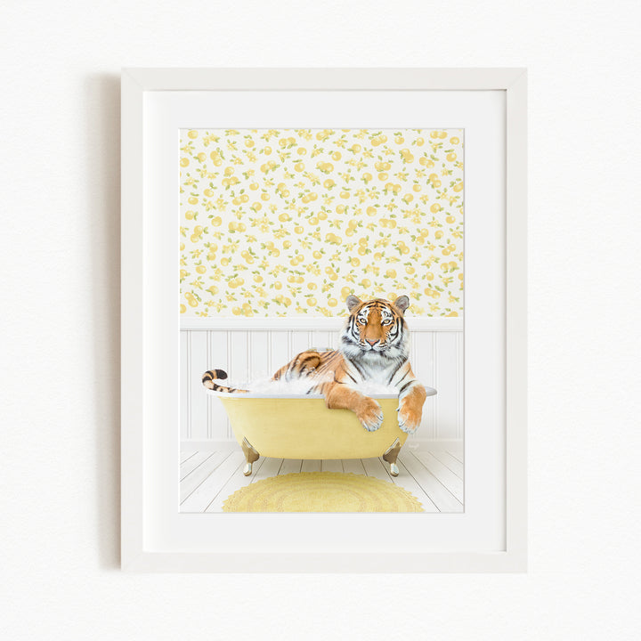 A tiger is sitting in a yellow bathtub, surrounded by a yellow and white floral patterned wall.