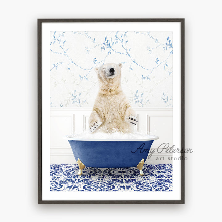 a polar bear sitting in a blue bath tub