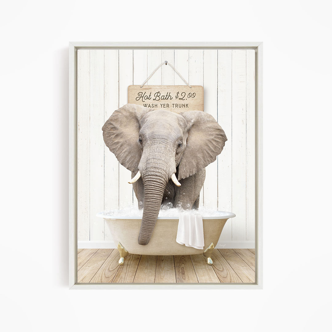 A gray elephant standing in a white bathtub, with a sign above it that reads "Hot Bath $2.00 Wash Your Trunk".
