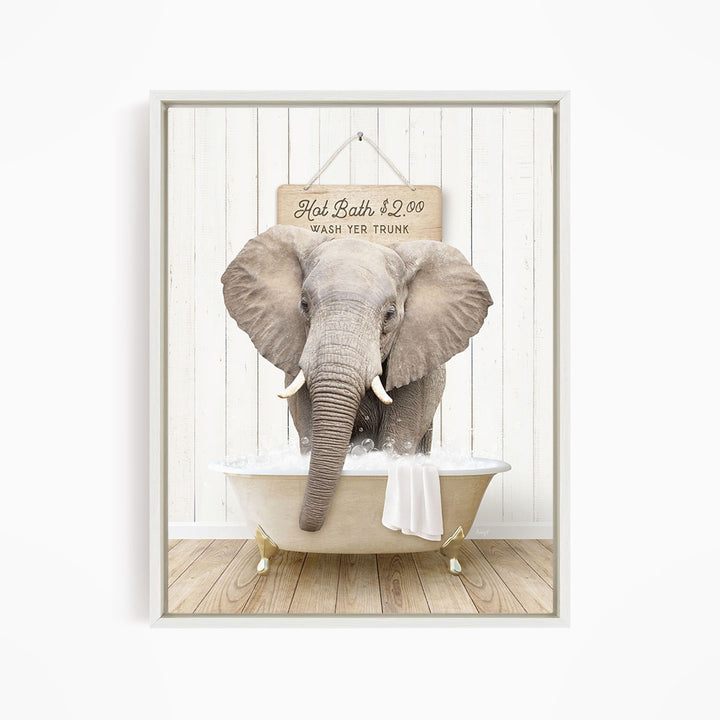 A gray elephant standing in a white bathtub, with a sign above it that reads "Hot Bath $2.00 Wash Your Trunk".
