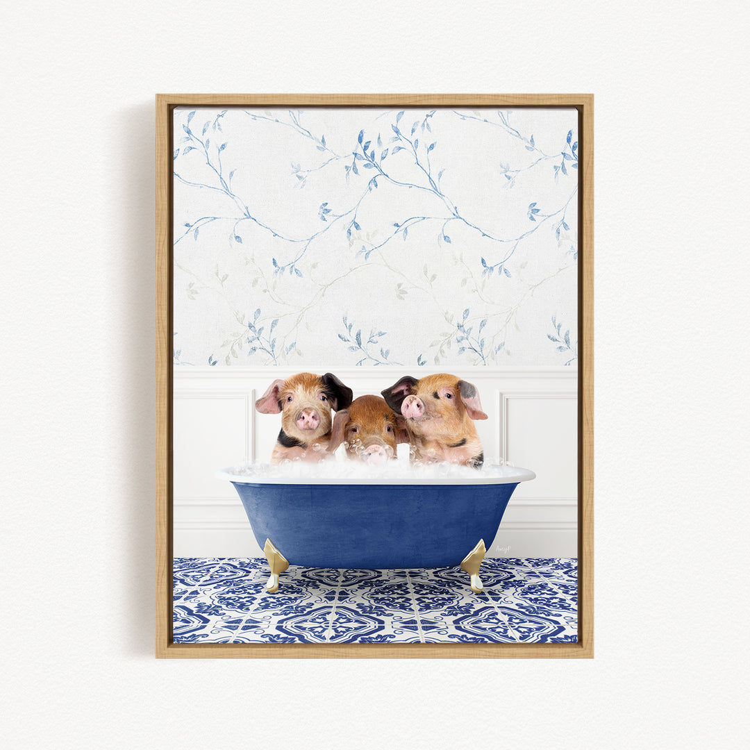 Three adorable pigs sitting in a blue bathtub, with a floral patterned wall behind them.