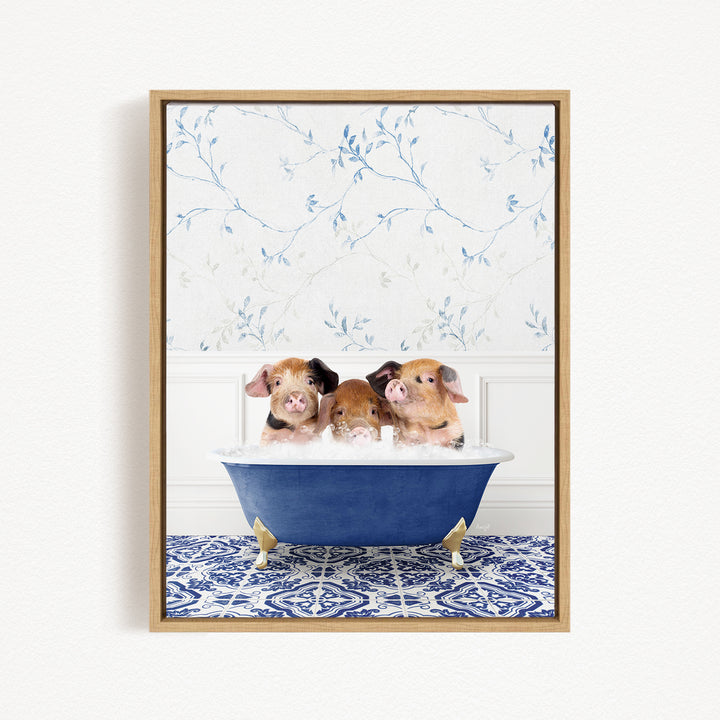 Three adorable pigs sitting in a blue bathtub, with a floral patterned wall behind them.