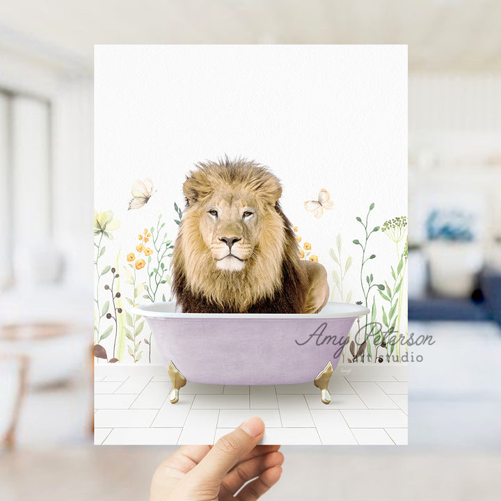 a hand holding a card with a lion in a bathtub