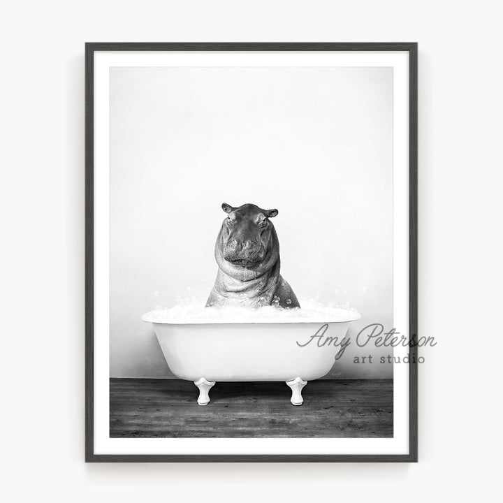 a black and white photo of a hippo in a bathtub