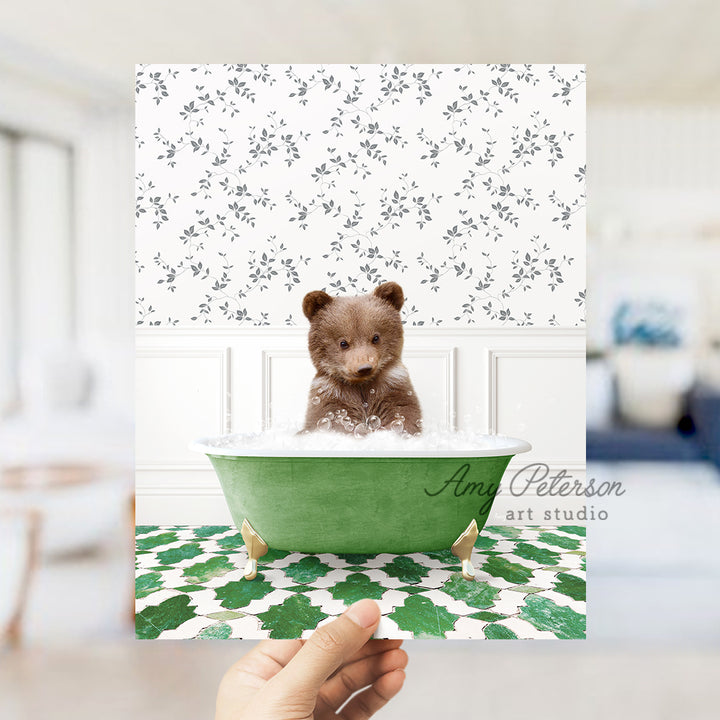 a person holding up a card with a picture of a teddy bear in a bath