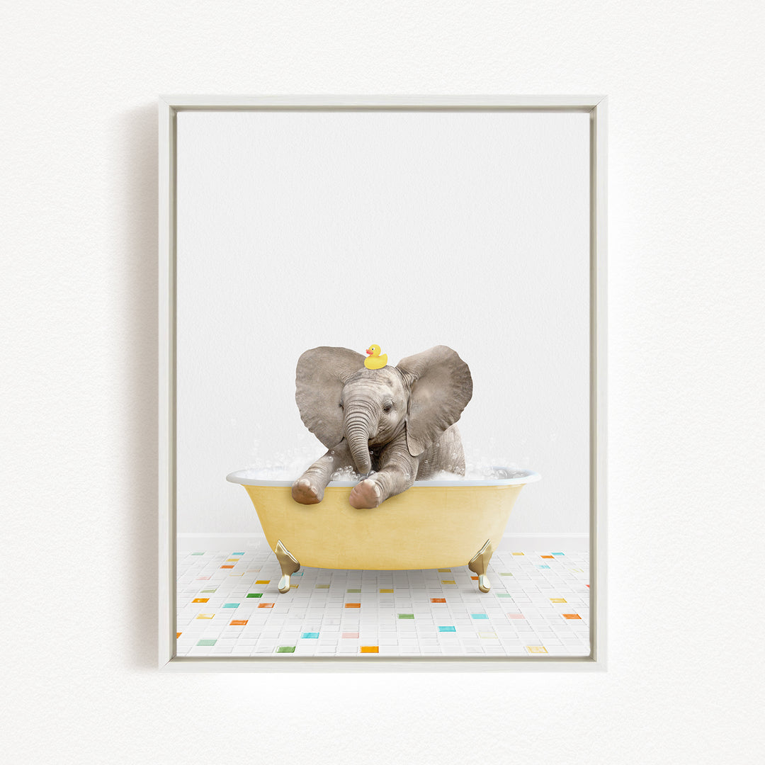 A baby elephant sitting in a yellow bathtub, with a yellow rubber duck on its head.