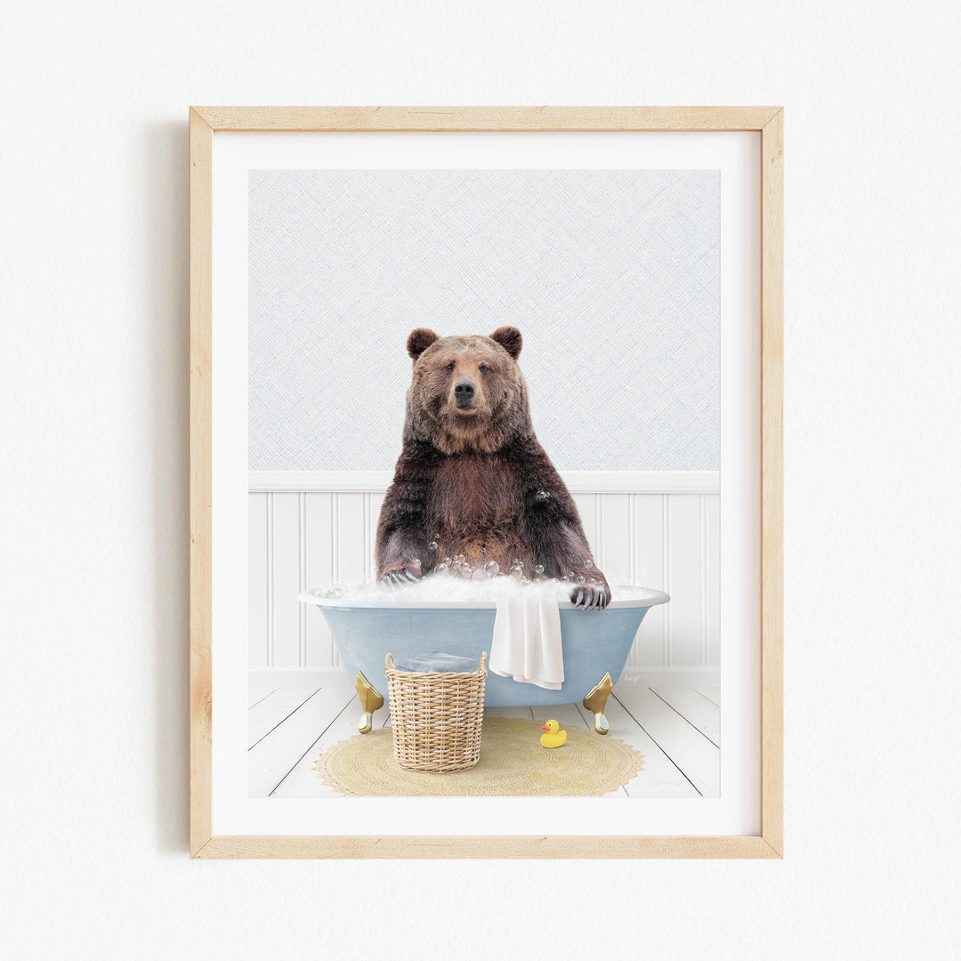 A brown bear sitting in a blue bathtub filled with water, surrounded by a yellow rubber duck and a wicker basket.