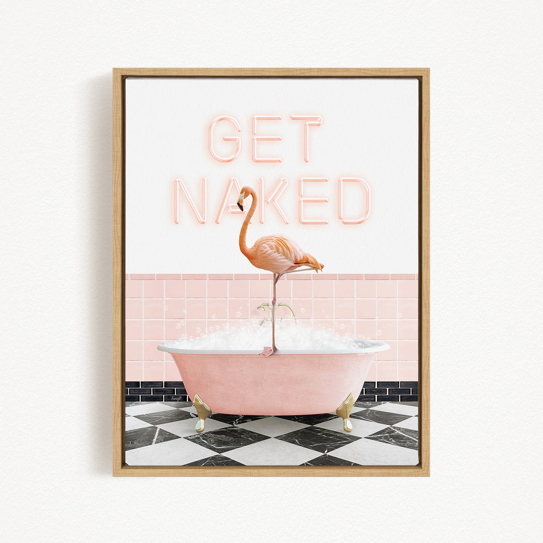 A framed print featuring a pink bathtub with a flamingo standing on it, and the text "GET NAKED" written above the flamingo.