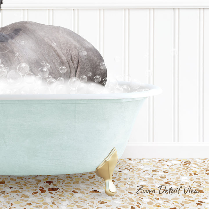 A light blue bathtub filled with bubbles, with a gray elephant partially submerged in the water.