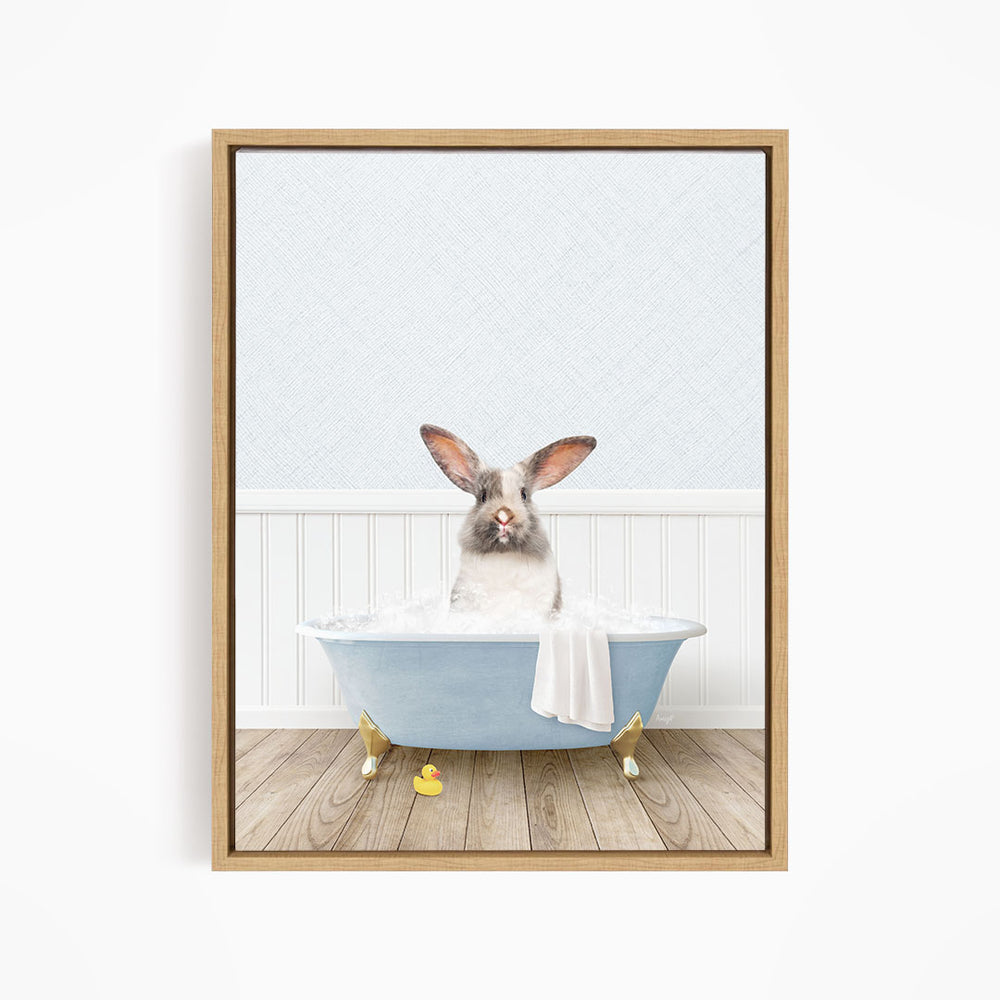 A white rabbit sitting in a blue bathtub filled with water, surrounded by rubber ducks.