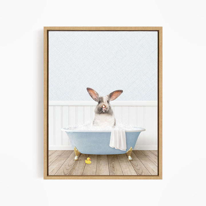 A white rabbit sitting in a blue bathtub filled with water, surrounded by rubber ducks.