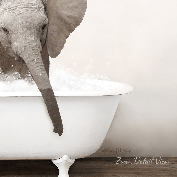 A gray elephant is standing in a white bathtub filled with bubbles, creating a whimsical and playful scene.