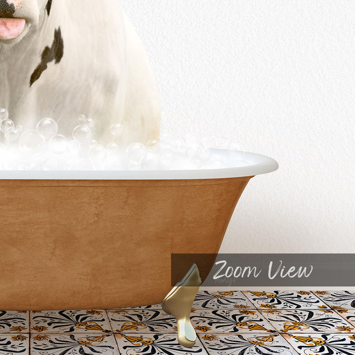 A white cow with black spots is standing in a bathtub filled with bubbles, with a gold bathtub leg visible on the floor.