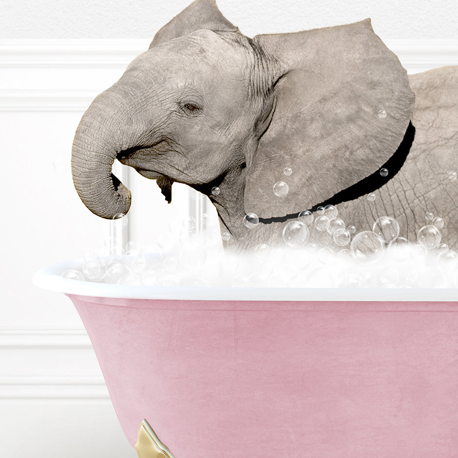 a baby elephant taking a bath in a pink bathtub