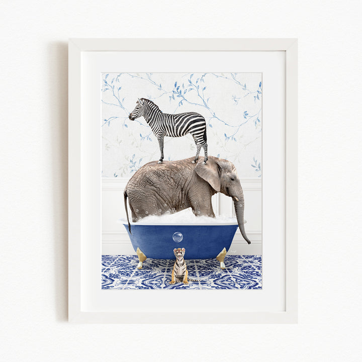 A framed image depicting a zebra standing on an elephant's back while the elephant is submerged in a blue bathtub, with a tiger sitting on the edge of the tub.