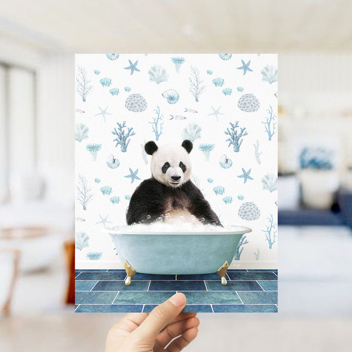 A panda bear sitting in a bathtub filled with bubbles, surrounded by a pattern of seashells, starfish, and other marine life.