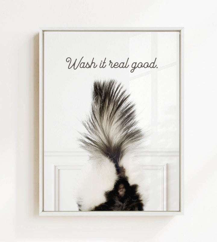a close-up of a skunk's tail with the text "Wash it real good."