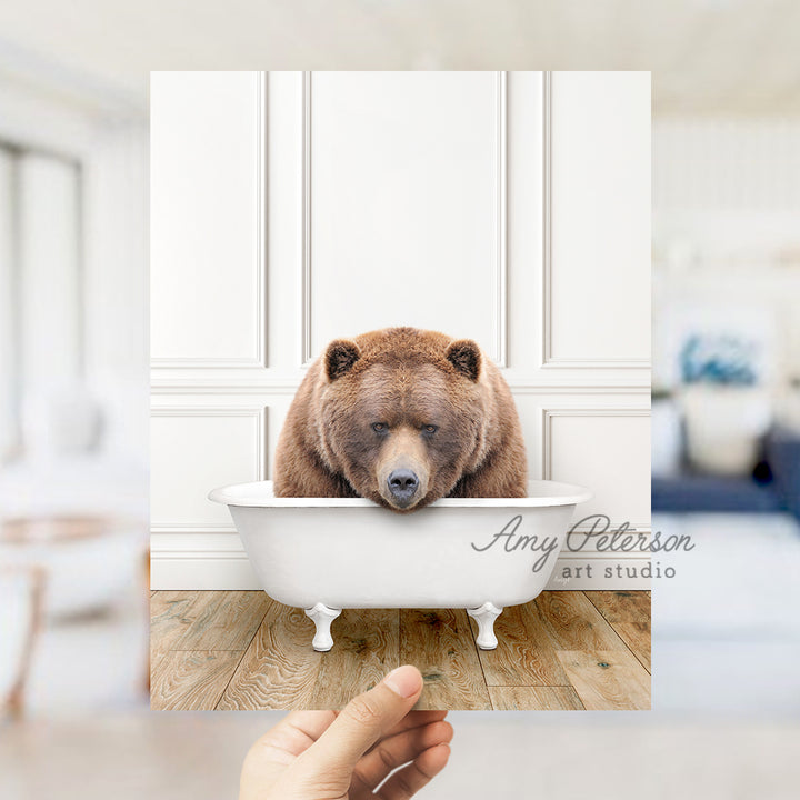 a brown bear sitting in a bath tub