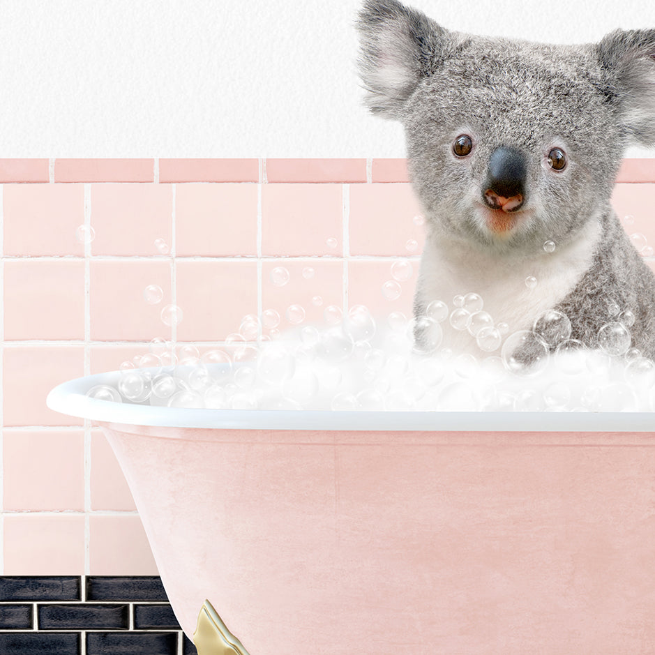 a koala is sitting in a bathtub full of bubbles