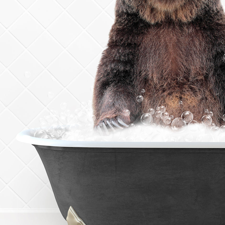 a brown bear sitting in a bathtub filled with bubbles