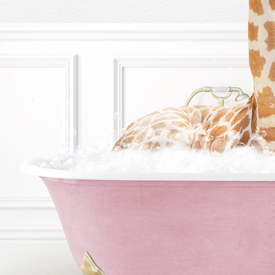 a giraffe laying in a pink bath tub